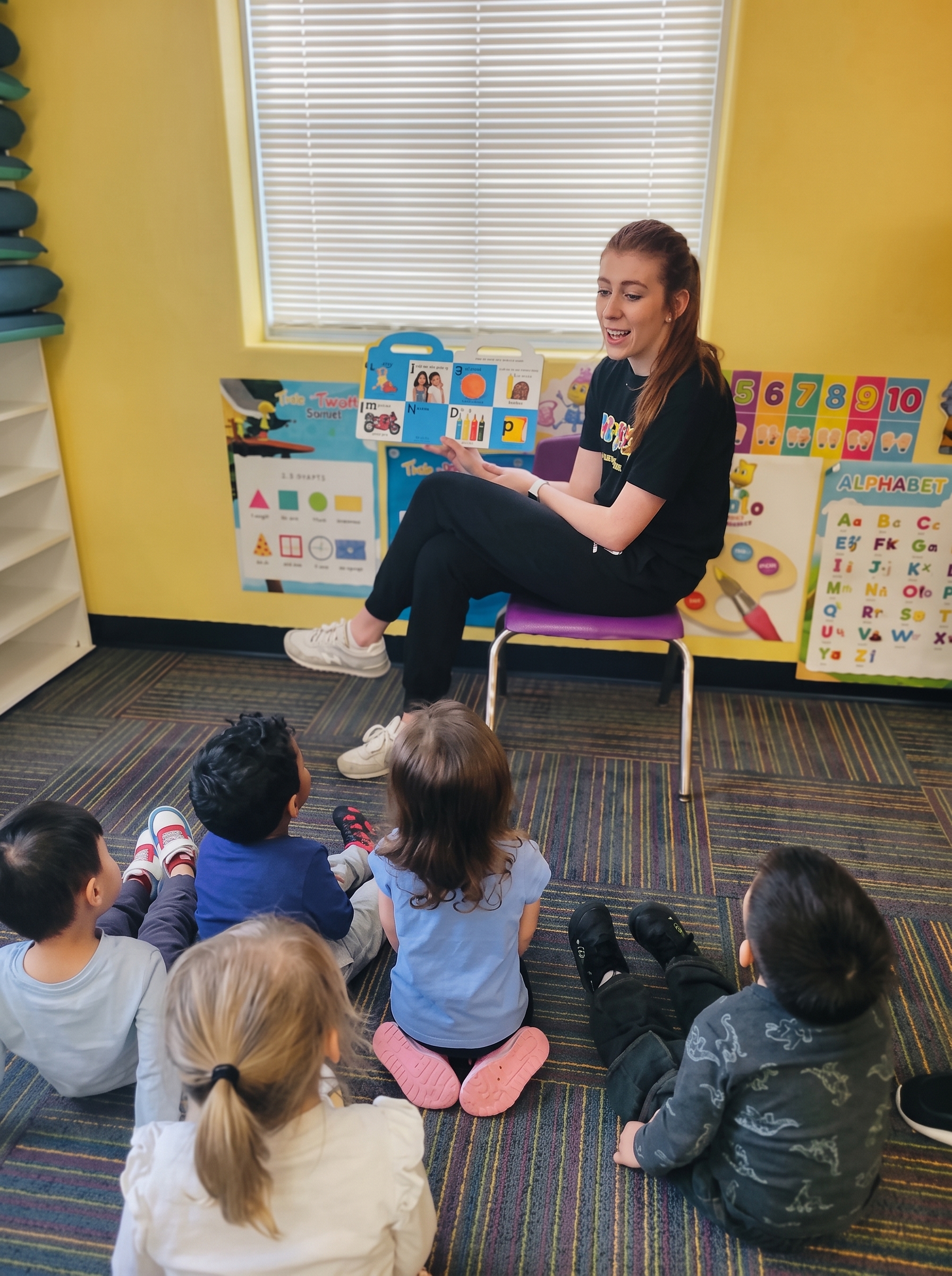 Elizabeth reading storybook with kids